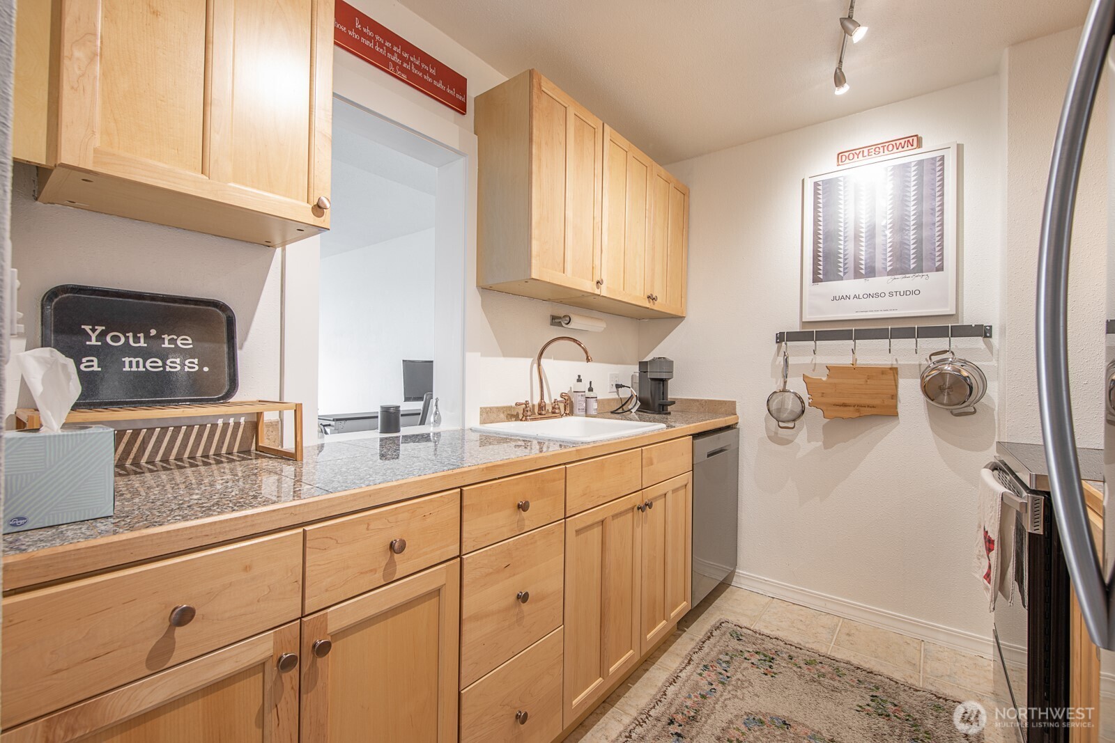308 East Republican Street, Unit 508 Seattle, WA 98102 - Photo 14 of 27 a kitchen with sink and cabinets