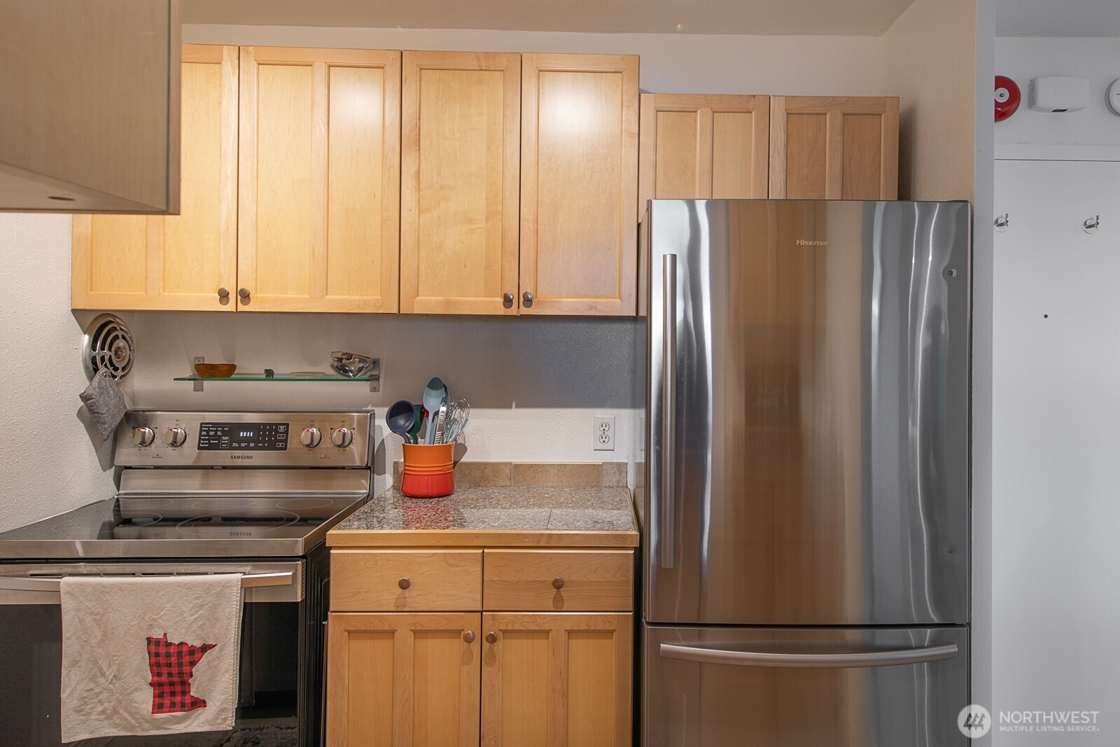 308 East Republican Street, Unit 508 Seattle, WA 98102 - Photo 15 of 27 a kitchen with refrigerator a stove a washer and dryer