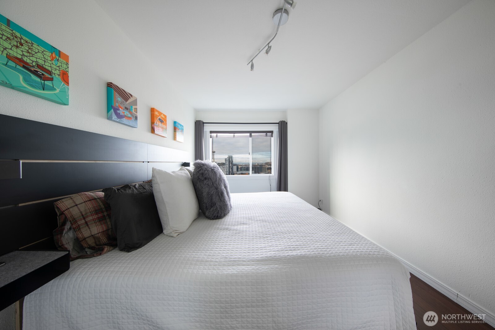 308 East Republican Street, Unit 508 Seattle, WA 98102 - Photo 17 of 27 a bedroom with a bed and window