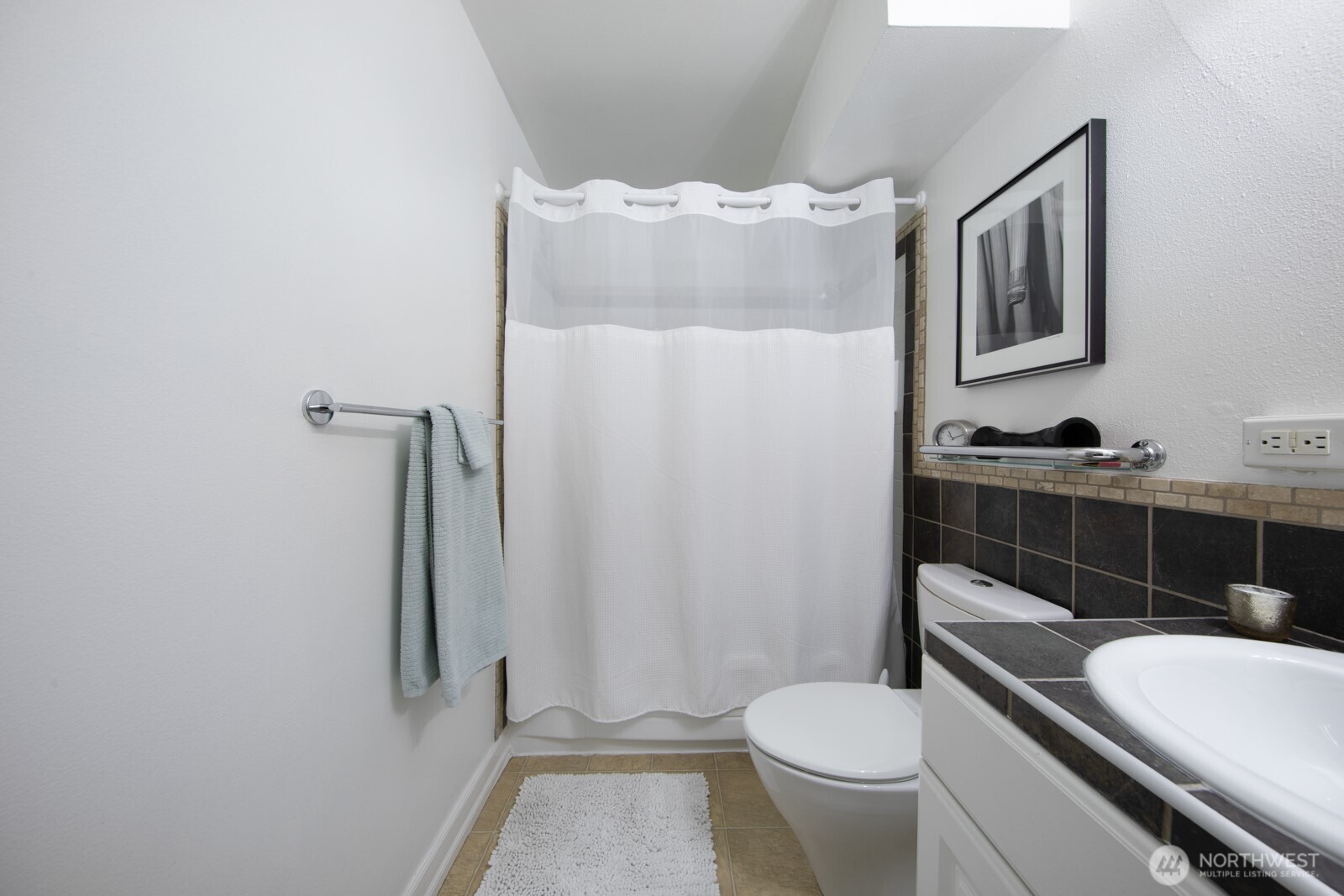 308 East Republican Street, Unit 508 Seattle, WA 98102 - Photo 20 of 27 a white toilet sitting next to a bathroom sink