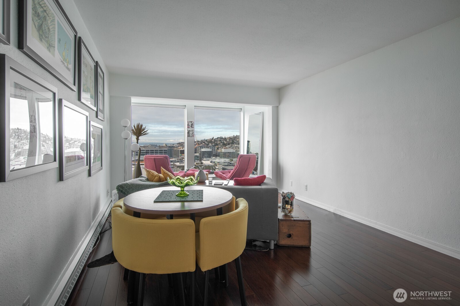 308 East Republican Street, Unit 508 Seattle, WA 98102 - Photo 7 of 27 a dining room with furniture and a potted plant