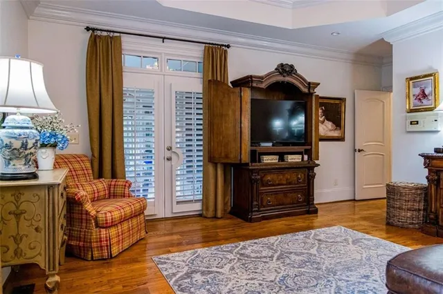 a room with furniture and paintings on the wall