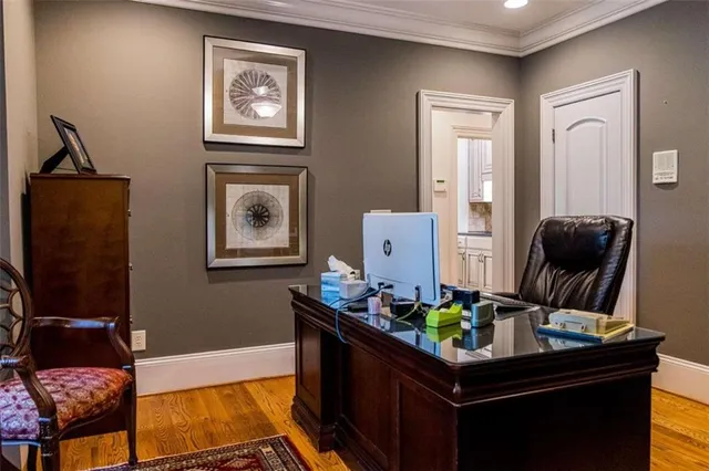 a bedroom with bed a couch and a chandelier
