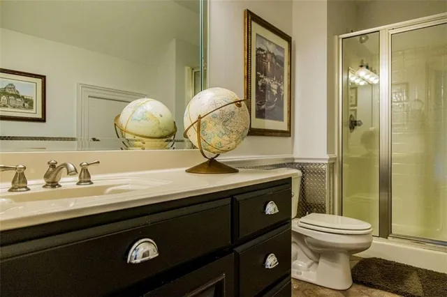 a living room with stainless steel appliances kitchen island granite countertop furniture a rug and a kitchen view