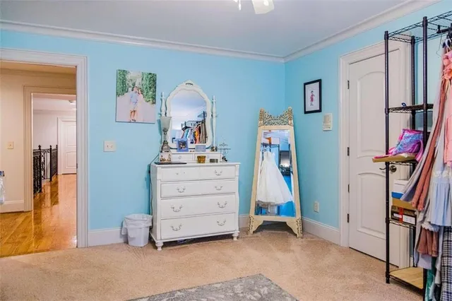 a view of a house with swimming pool and sitting area