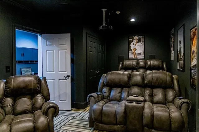 a view of a chair and table in backyard of the house
