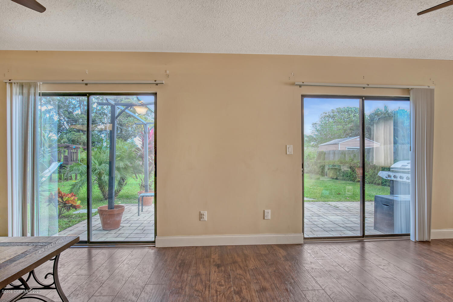 765 Angle Street Northeast Palm Bay, FL 32905 - Photo 16 of 42 Living Room Twin Sliders