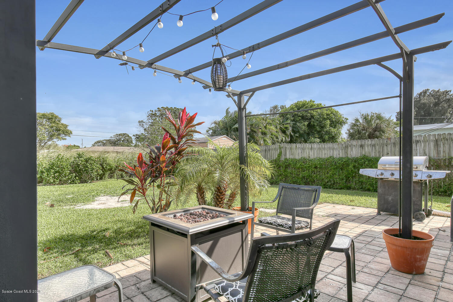 765 Angle Street Northeast Palm Bay, FL 32905 - Photo 28 of 42 Backyard Pavered Patio