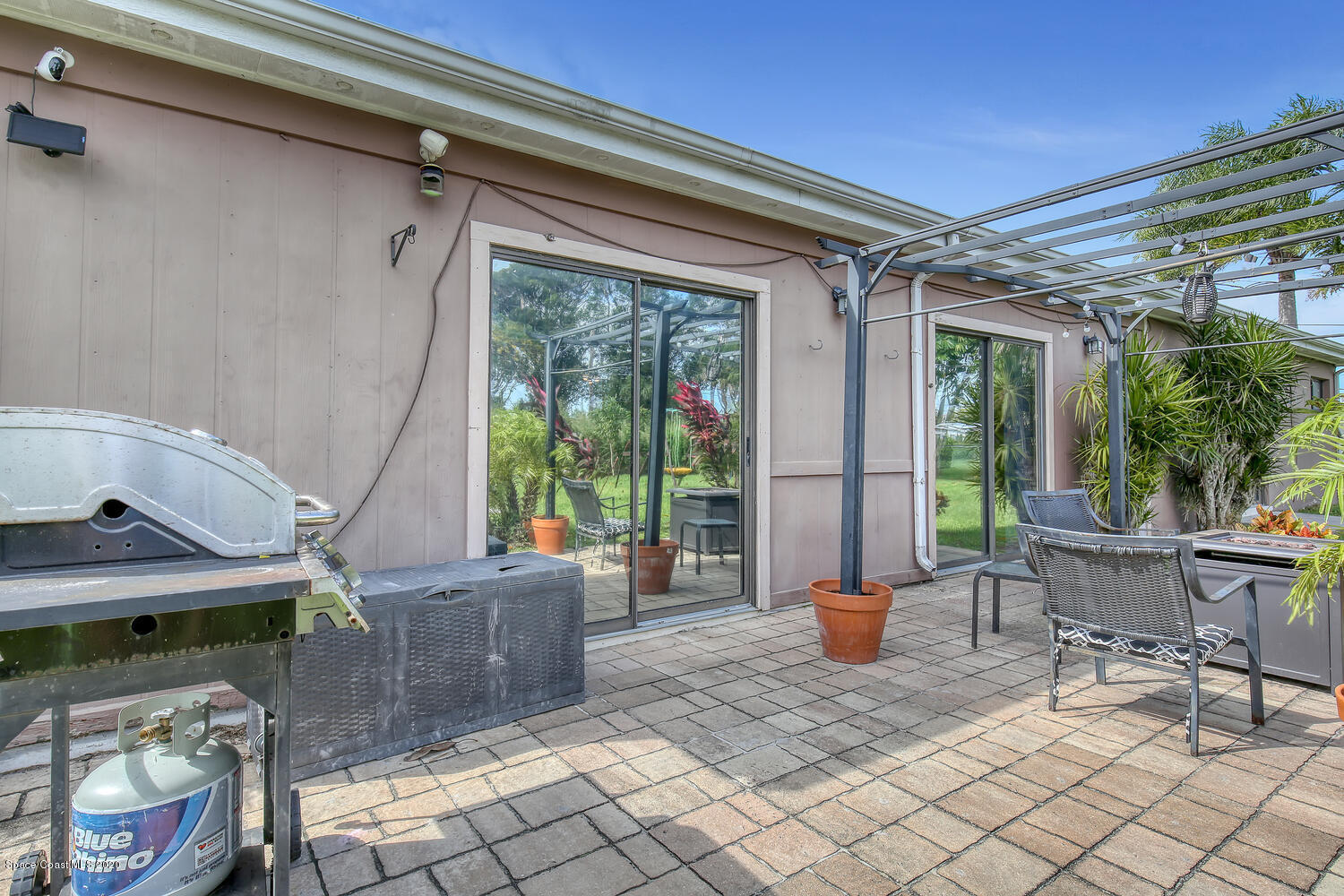 765 Angle Street Northeast Palm Bay, FL 32905 - Photo 30 of 42 Posterior Elevation with Pavered Patio