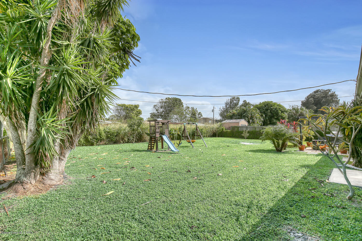765 Angle Street Northeast Palm Bay, FL 32905 - Photo 31 of 42 Backyard with Playset Angle 1