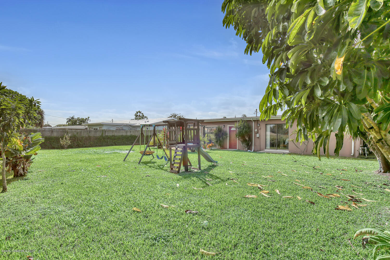 765 Angle Street Northeast Palm Bay, FL 32905 - Photo 32 of 42 Backyard with Playset Angle 2
