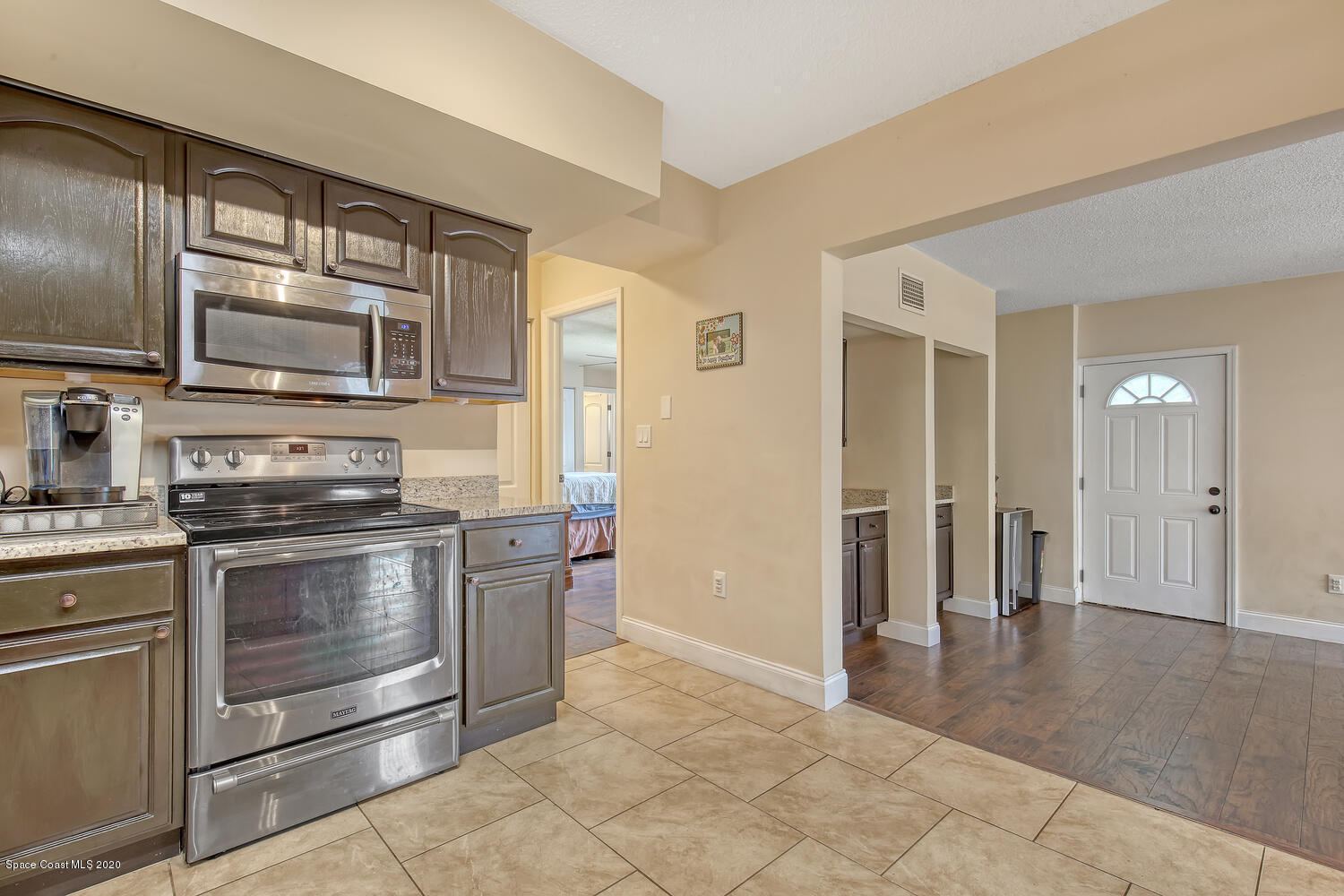 765 Angle Street Northeast Palm Bay, FL 32905 - Photo 7 of 42 Kitchen and Front Entrance