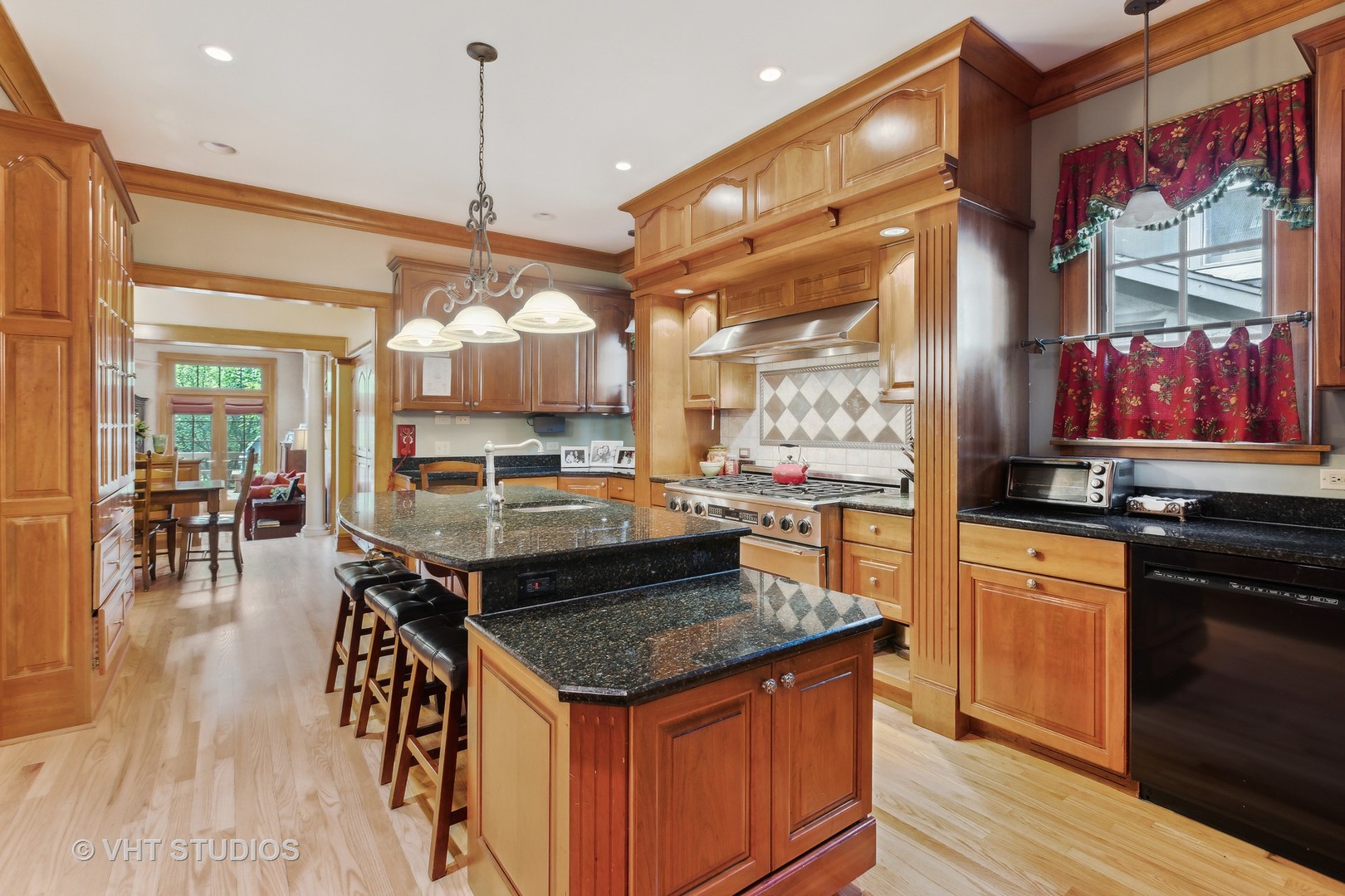 142 Akenside Road Riverside, IL 60546 - Photo 12 of 42 a kitchen with stainless steel appliances granite countertop a stove and a wooden floors