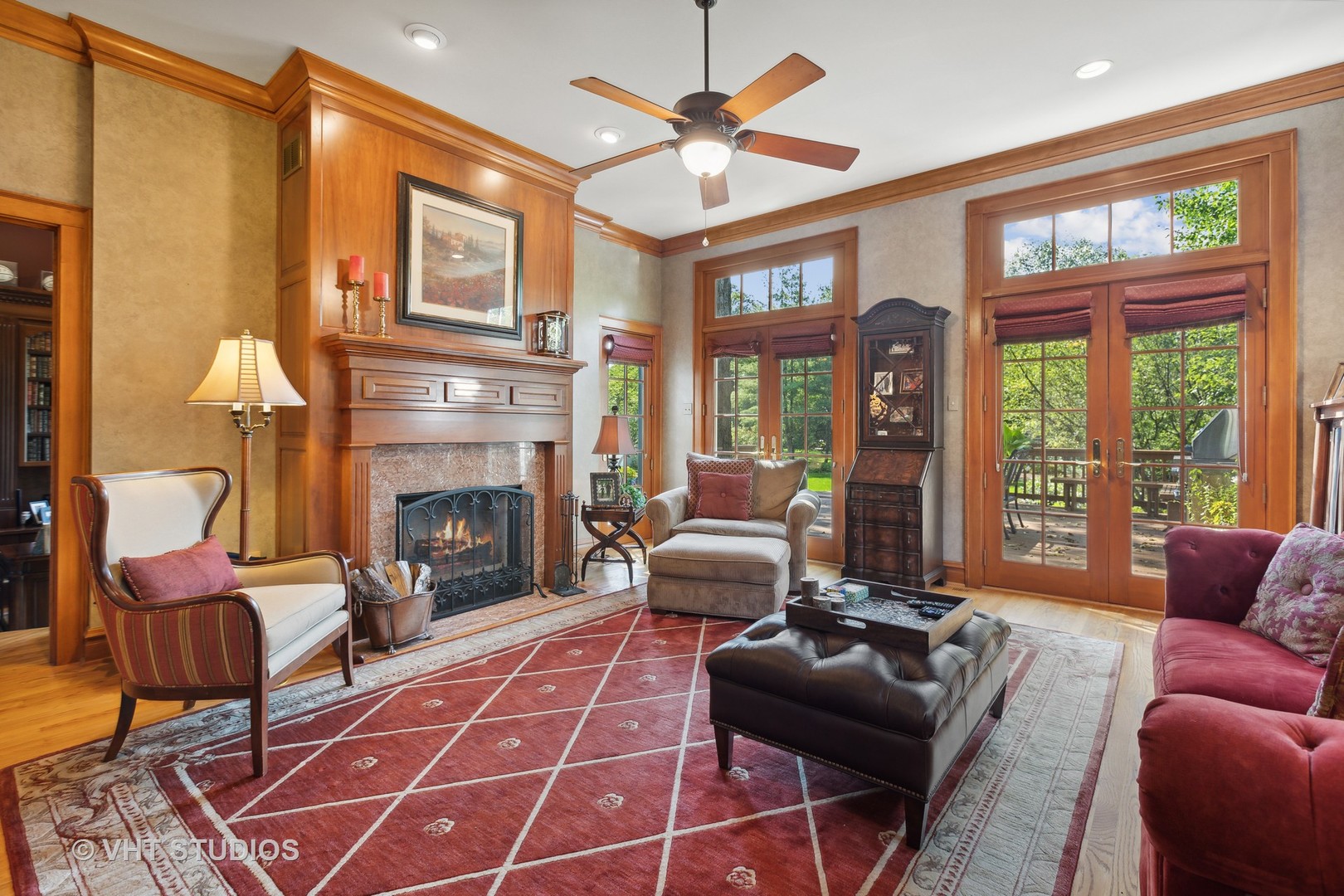 142 Akenside Road Riverside, IL 60546 - Photo 15 of 42 a living room with furniture a fireplace and a chandelier