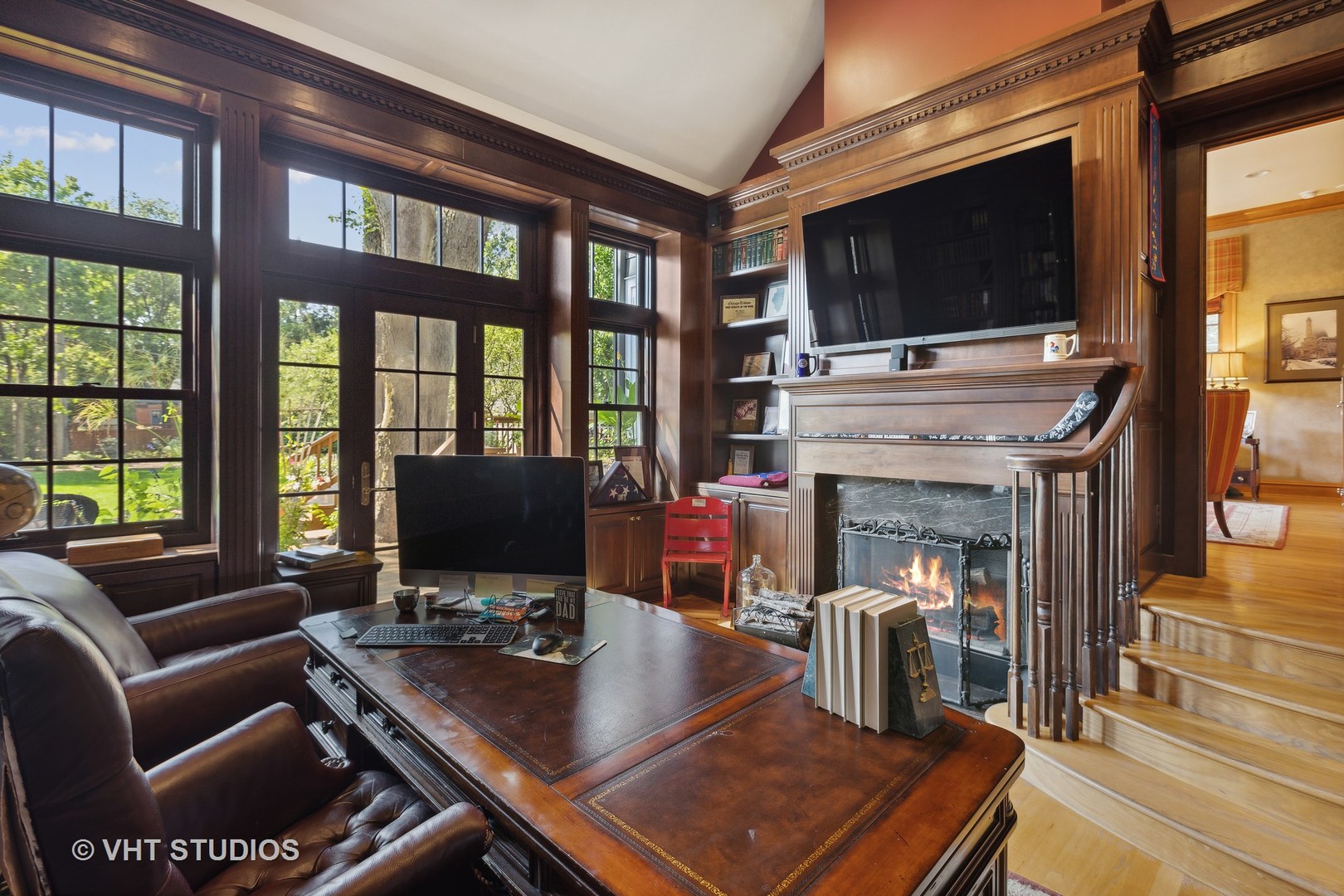 142 Akenside Road Riverside, IL 60546 - Photo 17 of 42 a living room with fireplace furniture and a flat screen tv