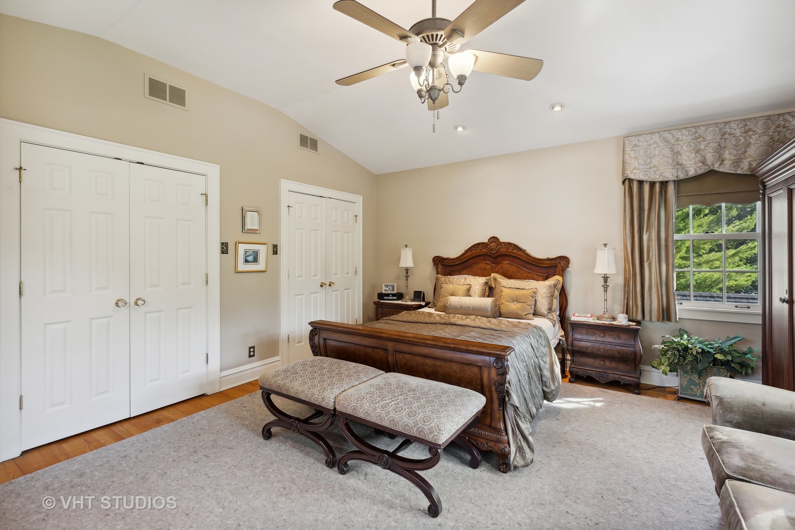 142 Akenside Road Riverside, IL 60546 - Photo 22 of 42 a bedroom with a bed and a chandelier