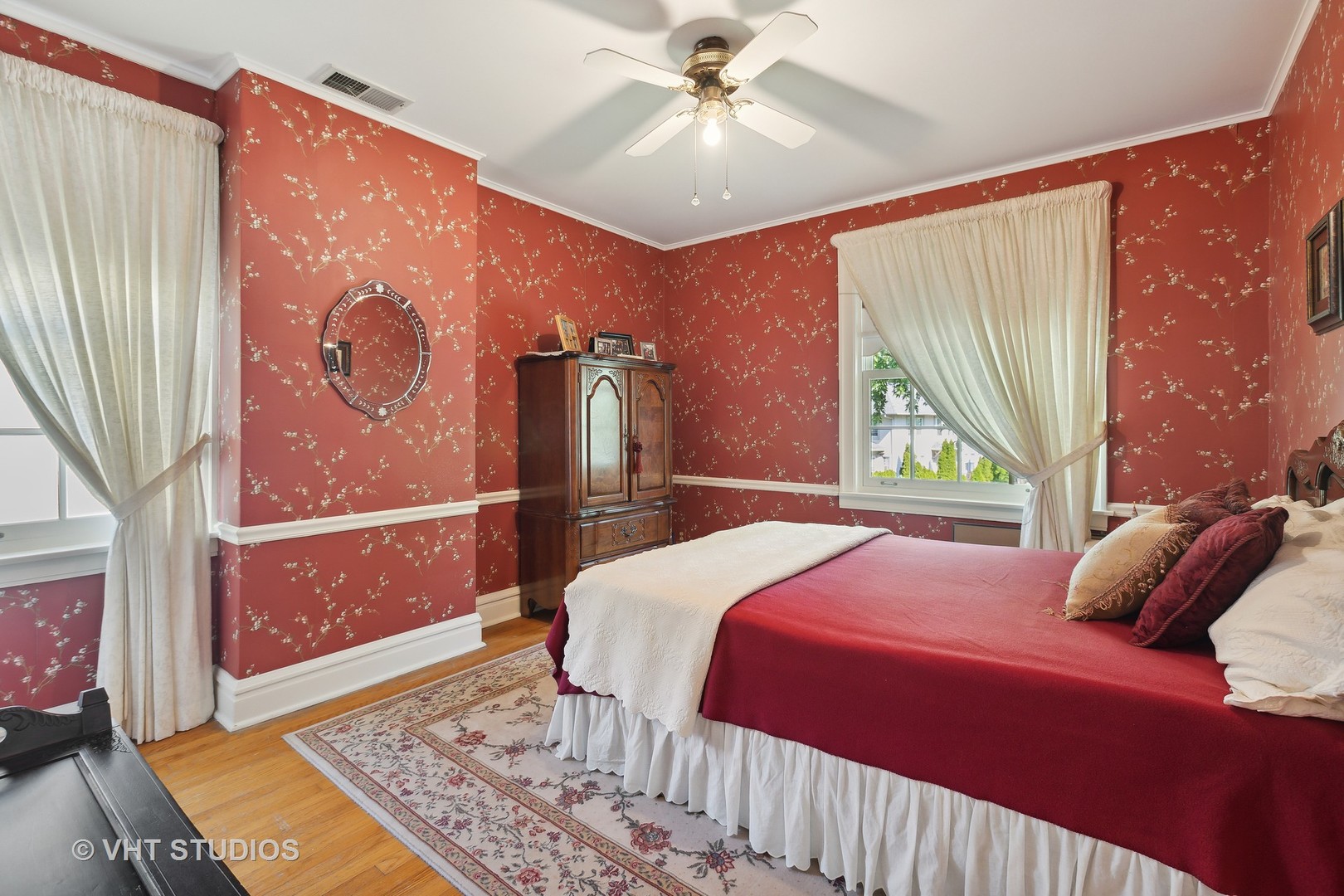 142 Akenside Road Riverside, IL 60546 - Photo 25 of 42 a bedroom with a large bed and a chandelier