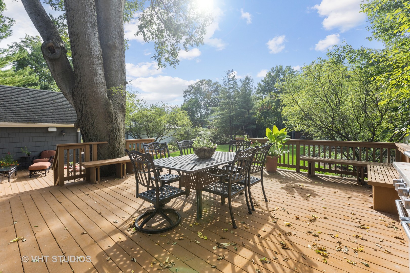 142 Akenside Road Riverside, IL 60546 - Photo 37 of 42 a view of a roof deck with table and chairs a barbeque with wooden floor and fence