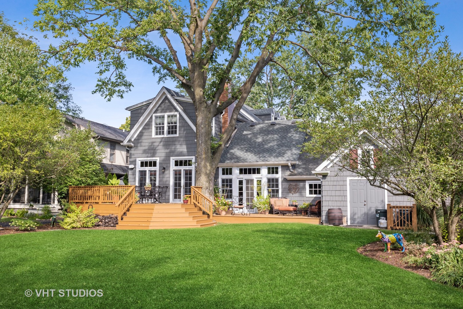142 Akenside Road Riverside, IL 60546 - Photo 40 of 42 a front view of a house with a garden and trees