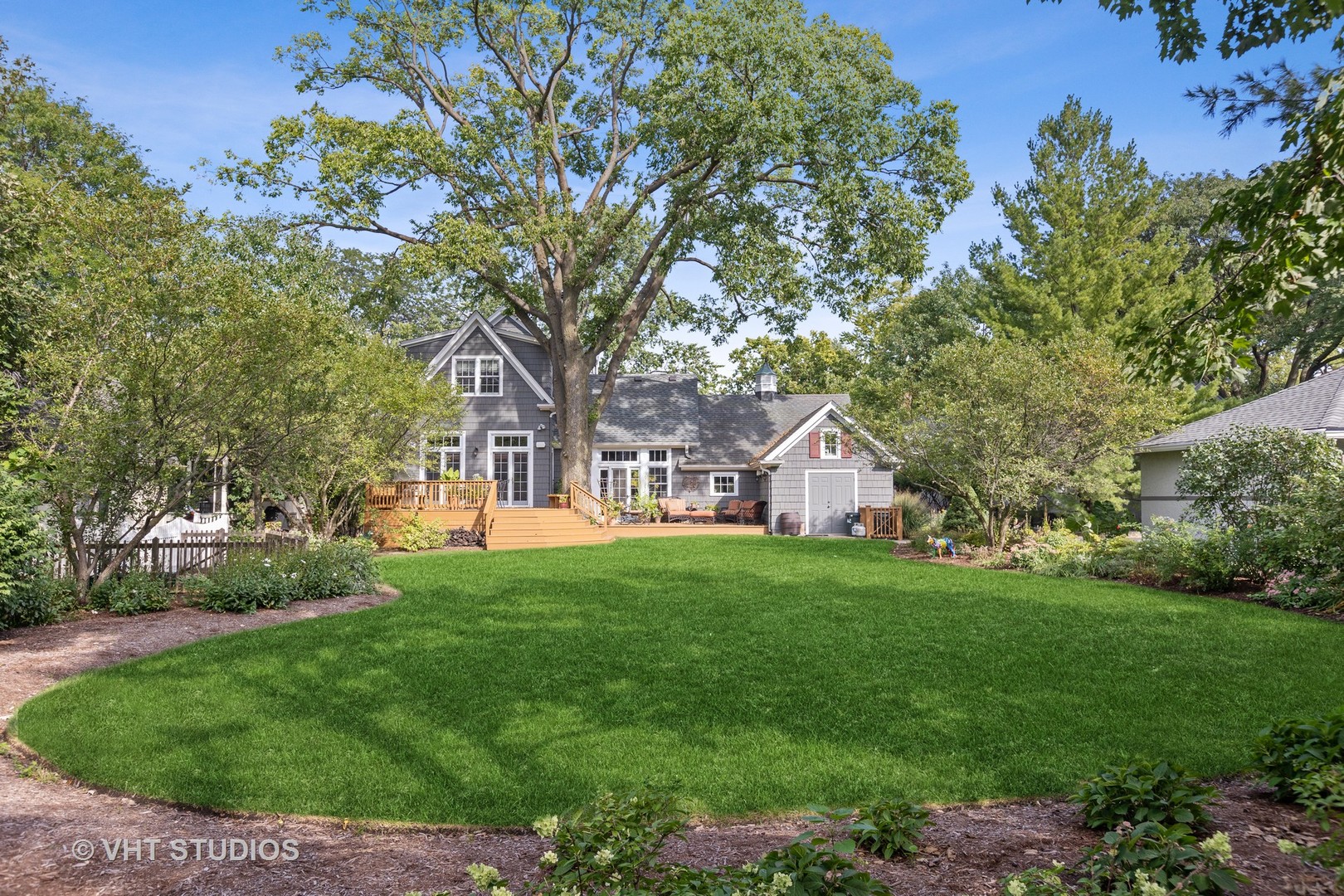 142 Akenside Road Riverside, IL 60546 - Photo 41 of 42 a front view of a house with a garden
