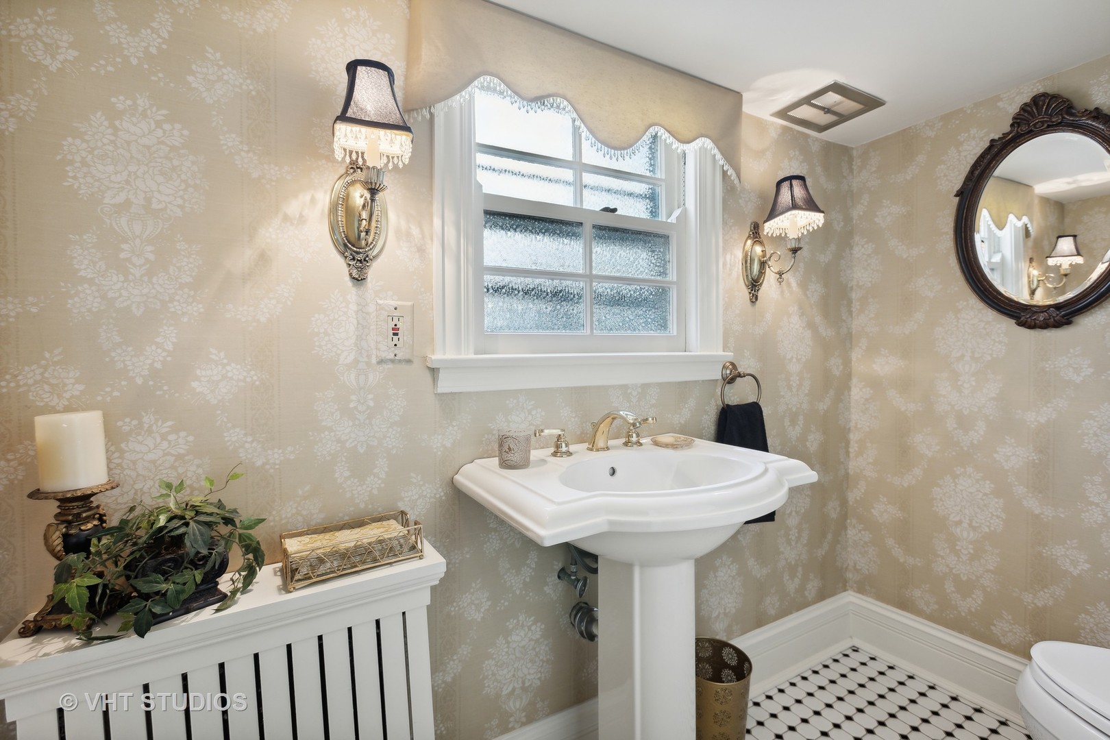 142 Akenside Road Riverside, IL 60546 - Photo 9 of 42 a bathroom with a sink and a mirror