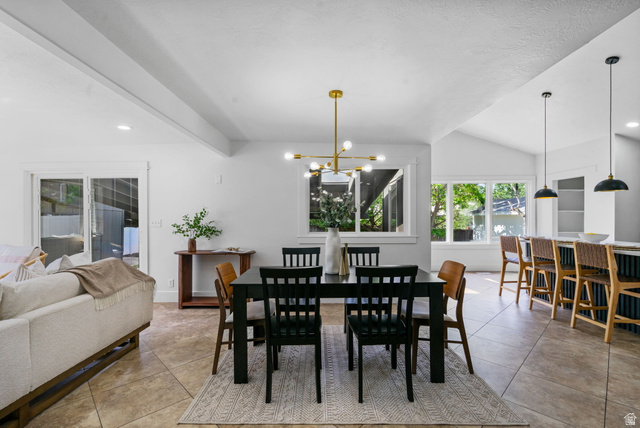 432 Calnette Drive Sandy, UT 84070 - Photo 8 of 48 Open-concept interior featuring vaulted ceilings, a modern linear chandelier, and tile flooring