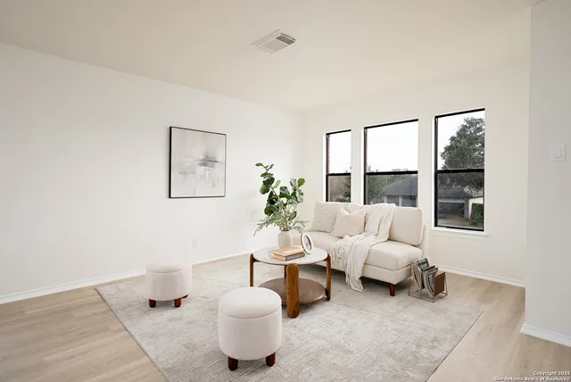 a living room with furniture and a window