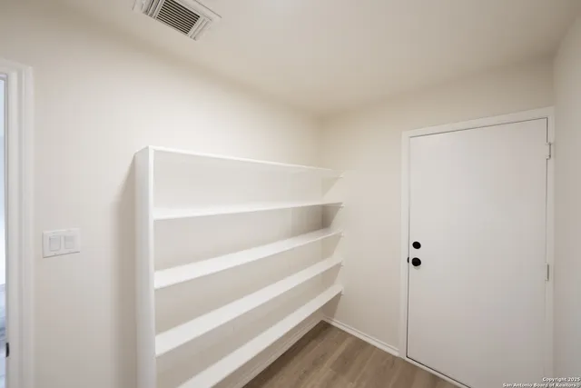 a view of an empty walk in closet