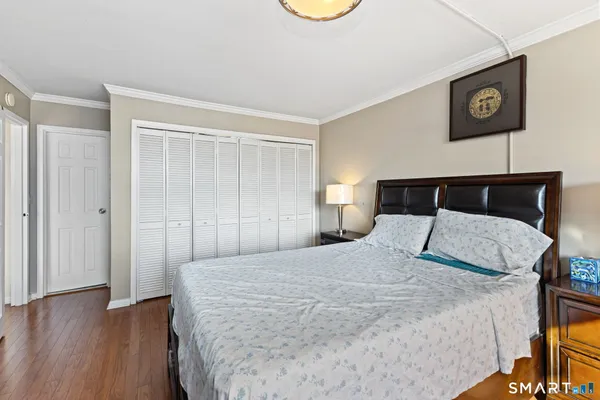 a bedroom with a bed and a table