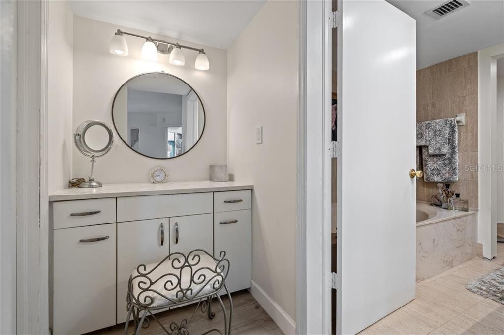 100 Southeast 5th Avenue, Unit 412 Boca Raton, FL 33432 - Photo 26 of 62 a bathroom with a sink and a mirror
