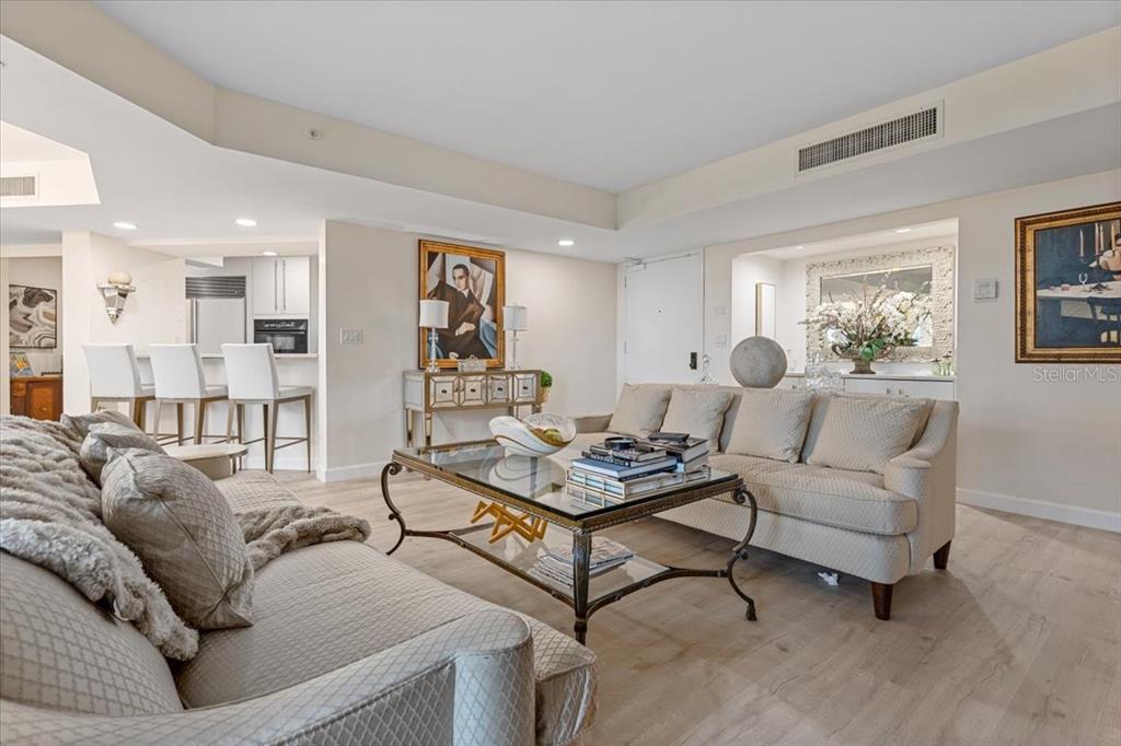 100 Southeast 5th Avenue, Unit 412 Boca Raton, FL 33432 - Photo 7 of 62 a living room with furniture and a table