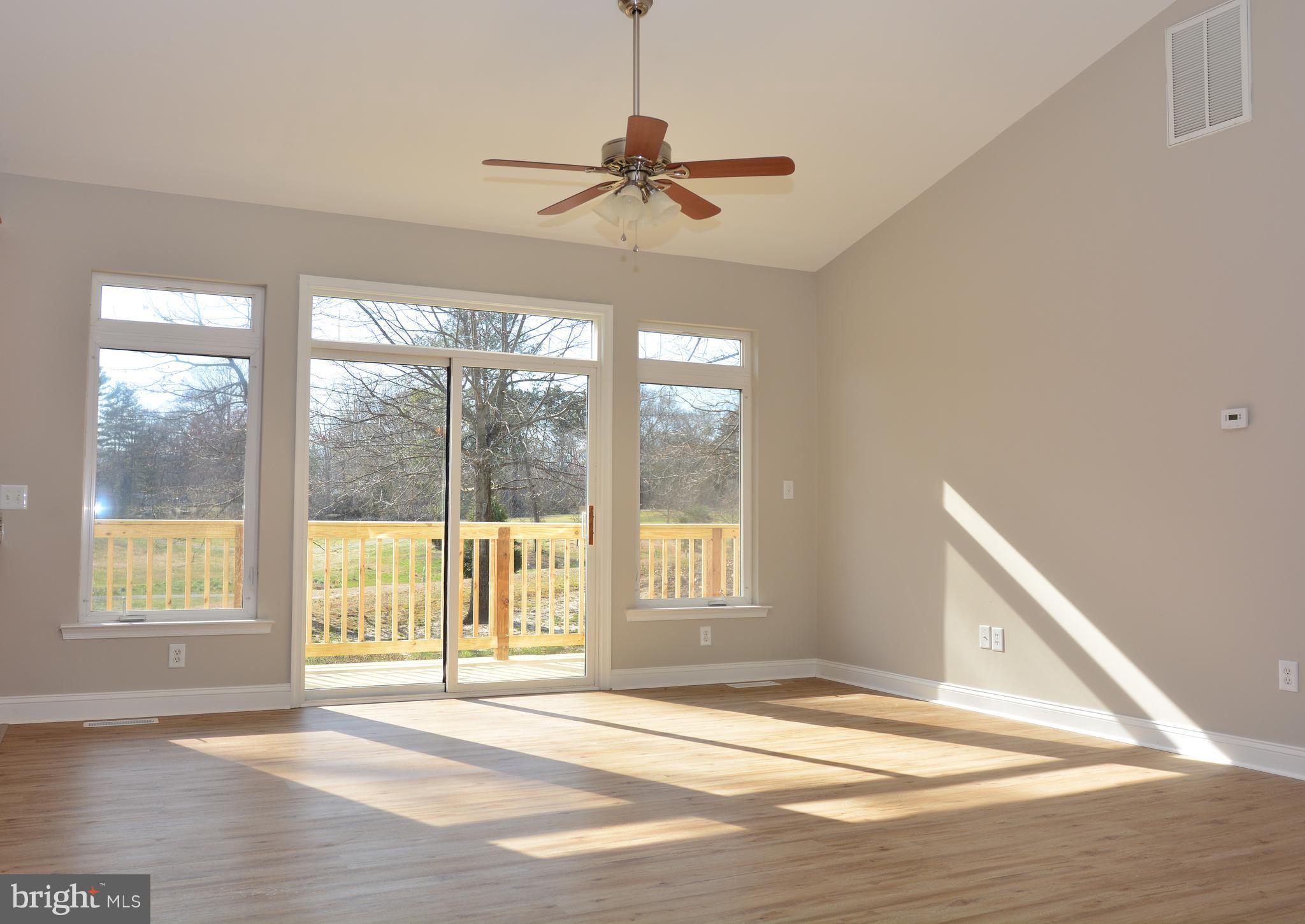 11231 Rawhide Road Lusby, MD 20657 - Photo 2 of 18 Living Room leads to Extra Large Deck