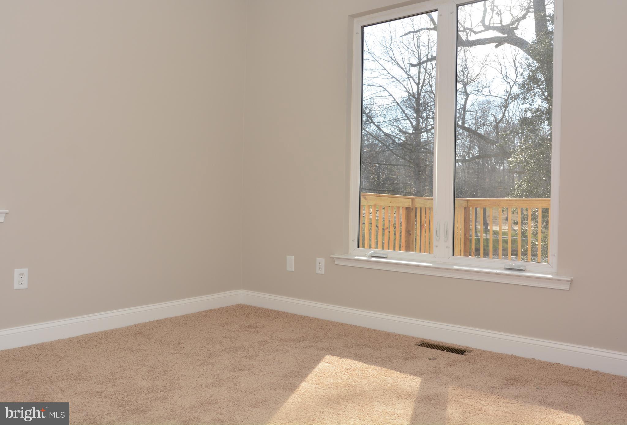 11231 Rawhide Road Lusby, MD 20657 - Photo 11 of 18 Large Window, Deck view, New Carpet & Paint