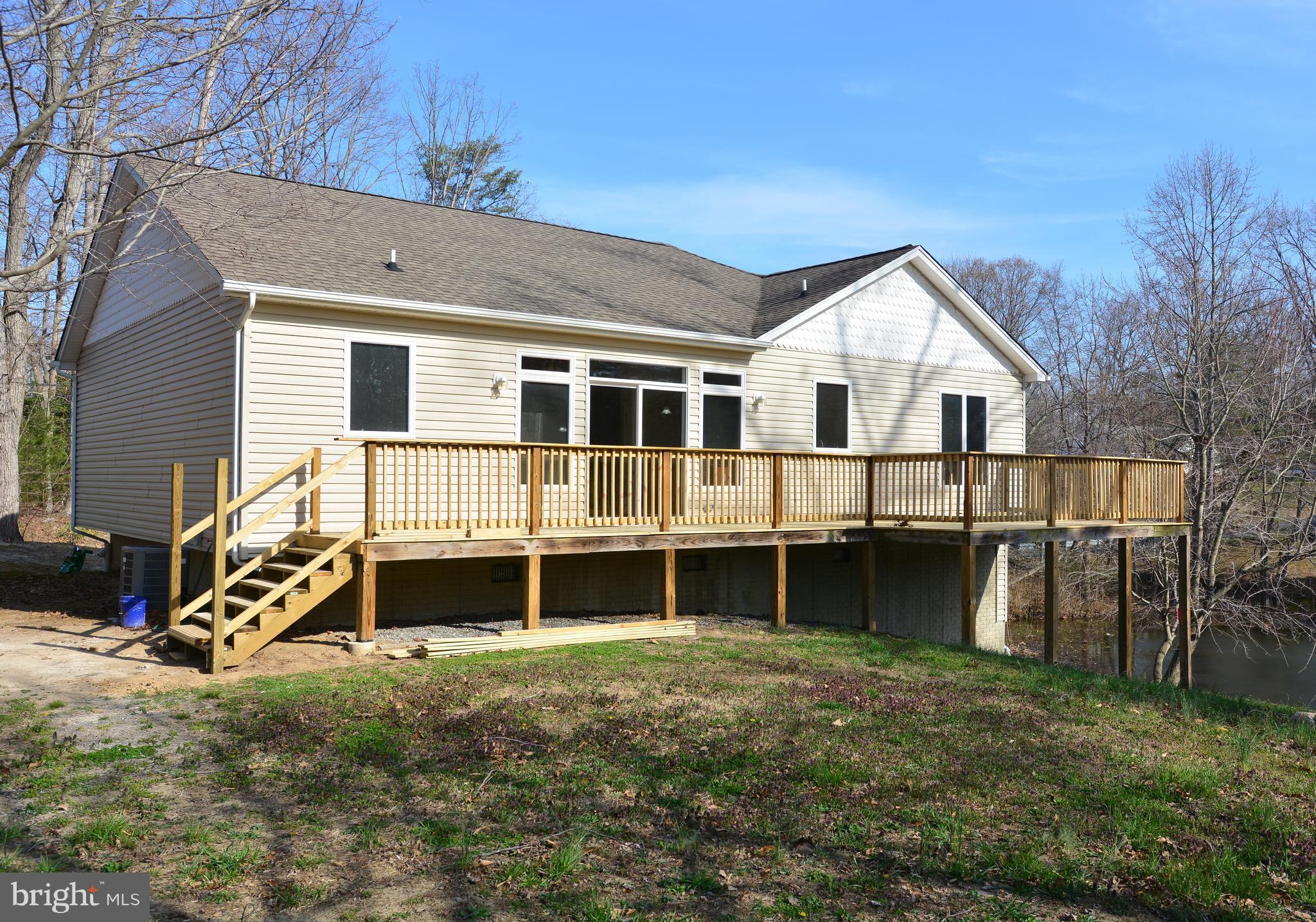 11231 Rawhide Road Lusby, MD 20657 - Photo 16 of 18 Large Deck overlooks the golf course