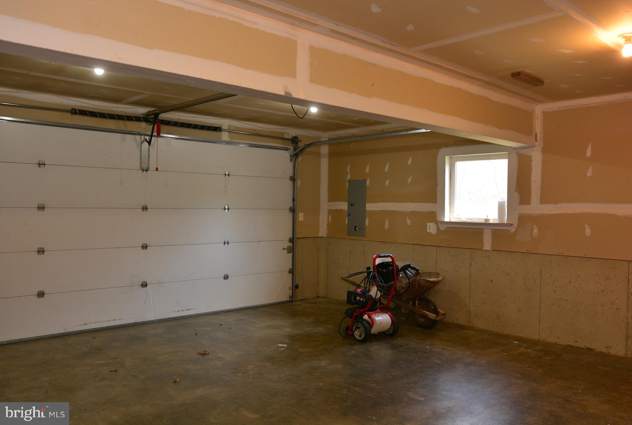 11231 Rawhide Road Lusby, MD 20657 - Photo 17 of 18 Garage; tons of space for vehicles and storage