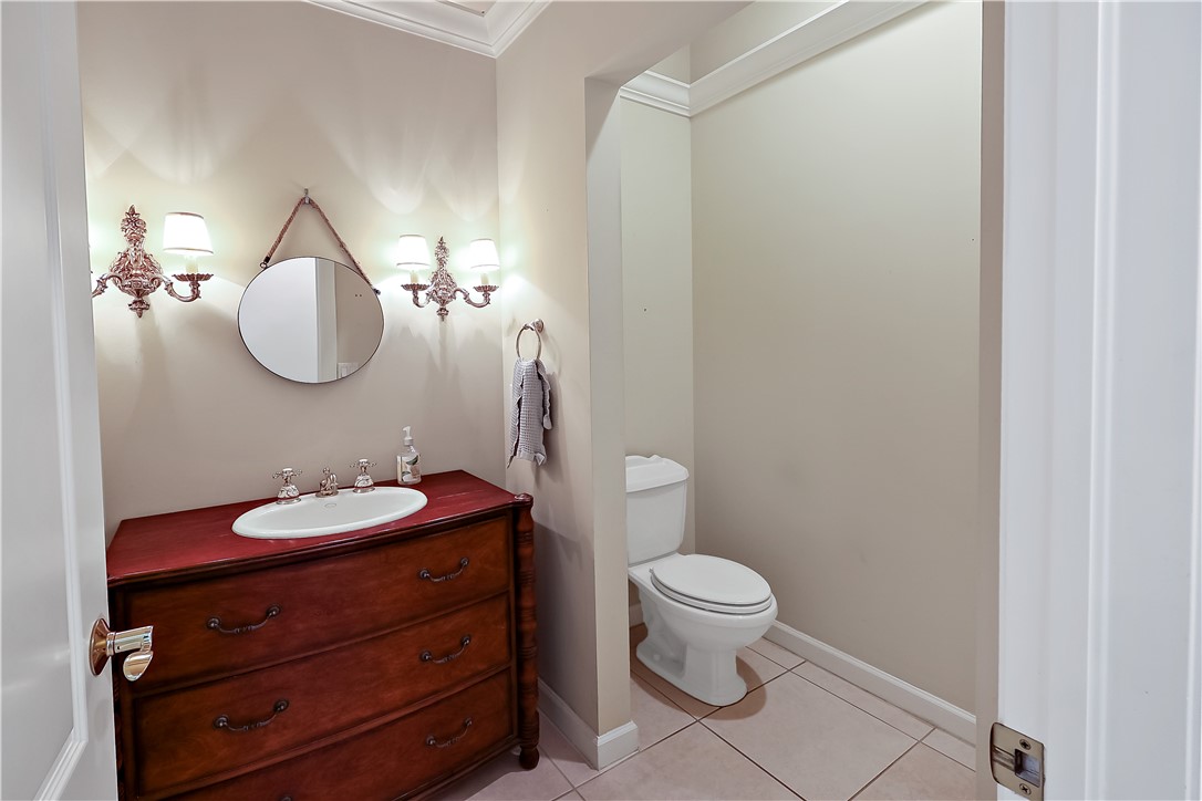 2038 Ocean Ridge Circle Vero Beach, FL 32963 - Photo 15 of 33 a bathroom with a toilet sink and mirror