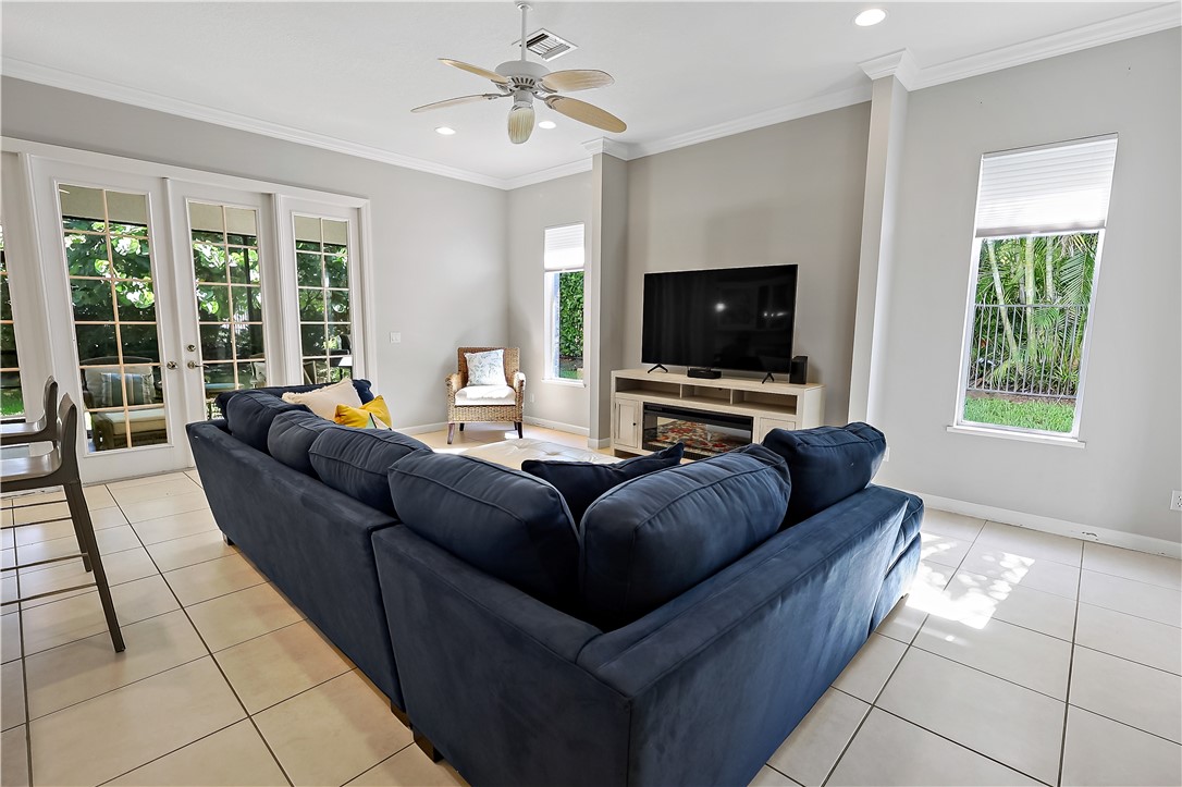 2038 Ocean Ridge Circle Vero Beach, FL 32963 - Photo 16 of 33 a living room with furniture and a flat screen tv