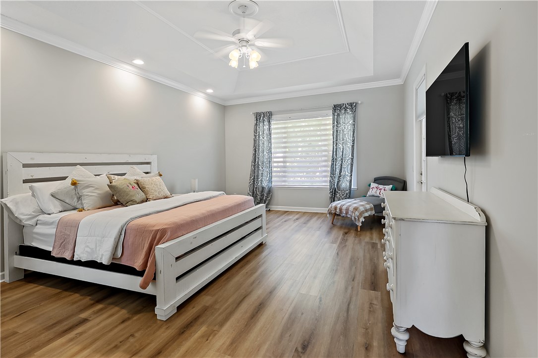 2038 Ocean Ridge Circle Vero Beach, FL 32963 - Photo 19 of 33 a bed room with a bed and a television