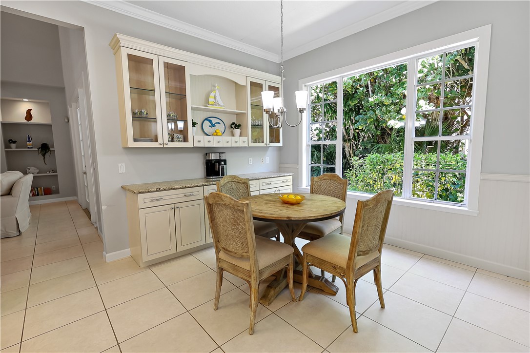 2038 Ocean Ridge Circle Vero Beach, FL 32963 - Photo 23 of 33 a dining room with furniture and window