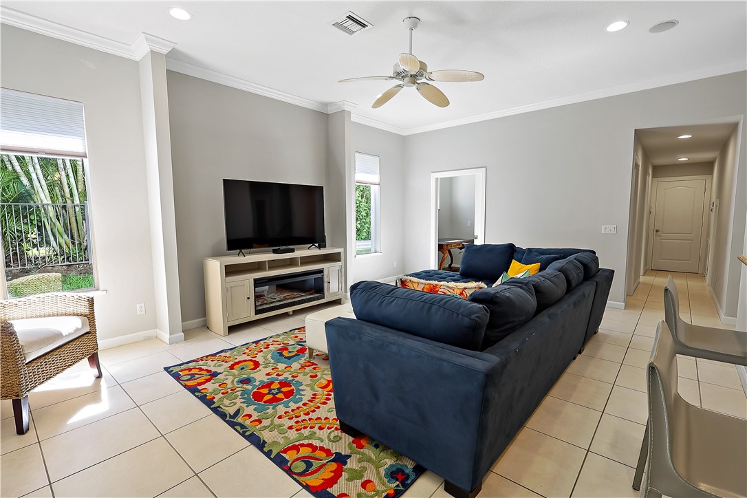 2038 Ocean Ridge Circle Vero Beach, FL 32963 - Photo 24 of 33 a living room with furniture and a flat screen tv