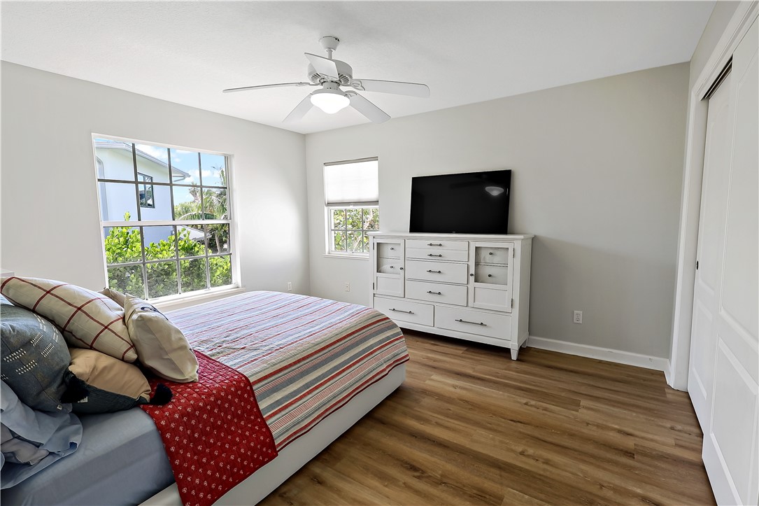 2038 Ocean Ridge Circle Vero Beach, FL 32963 - Photo 25 of 33 a bedroom with a bed and a television