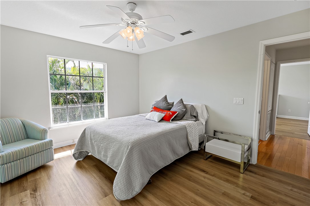 2038 Ocean Ridge Circle Vero Beach, FL 32963 - Photo 26 of 33 a bedroom with a bed and a couch