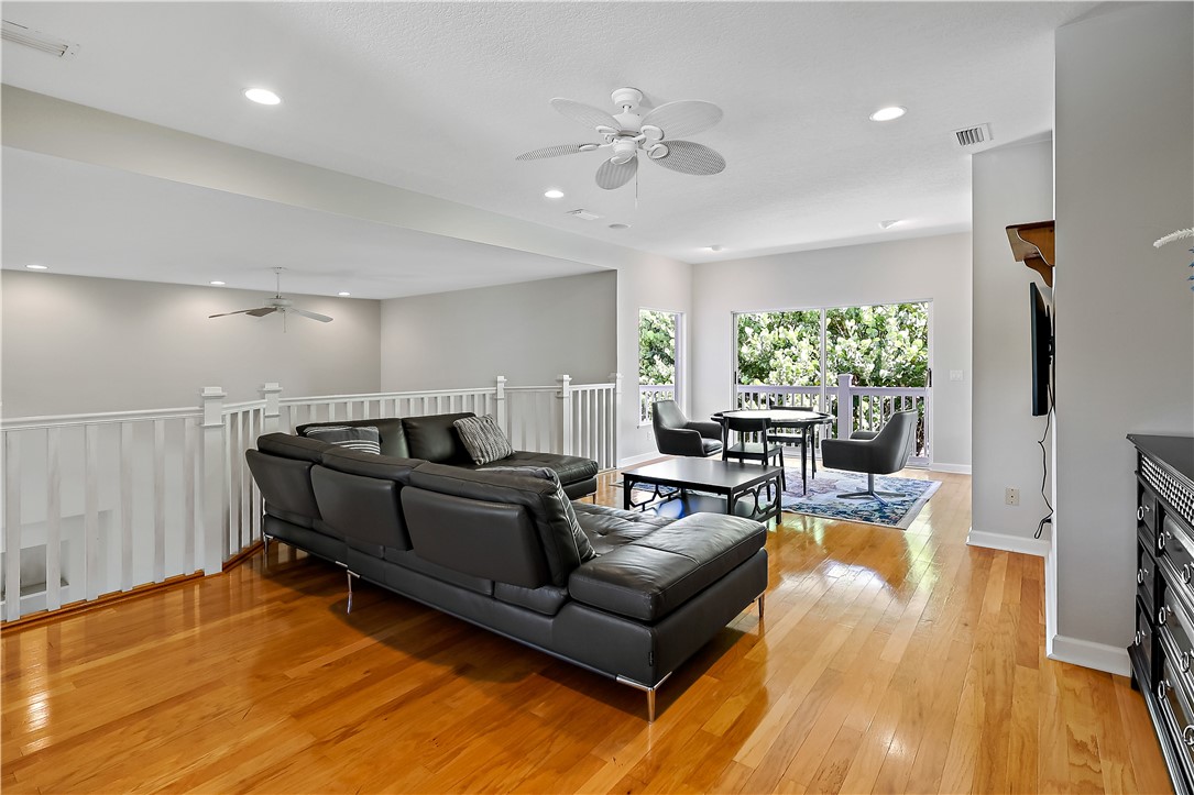 2038 Ocean Ridge Circle Vero Beach, FL 32963 - Photo 28 of 33 a living room with furniture and wooden floor