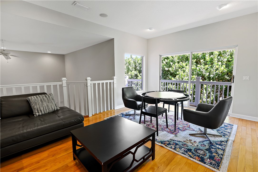 2038 Ocean Ridge Circle Vero Beach, FL 32963 - Photo 29 of 33 a living room with furniture and a wooden floor