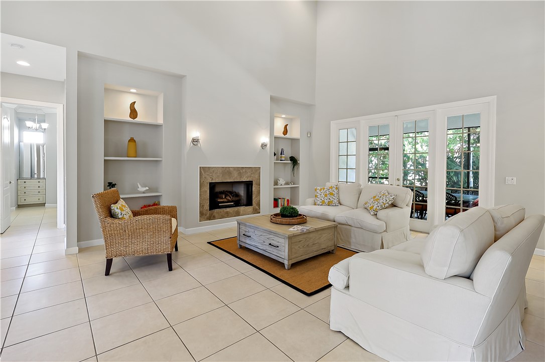 2038 Ocean Ridge Circle Vero Beach, FL 32963 - Photo 10 of 33 a living room with furniture and a fireplace