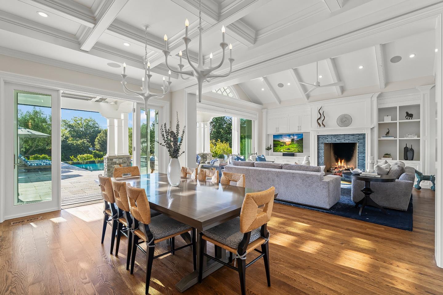 14966 Sobey Road Saratoga, CA 95070 - Photo 13 of 70 a view of a dining room with furniture wooden floor and chandelier