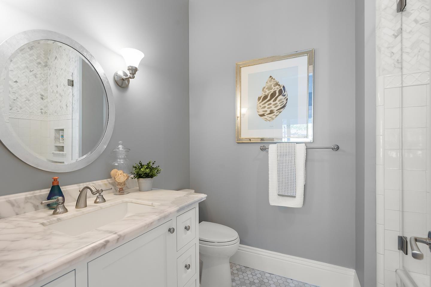 14966 Sobey Road Saratoga, CA 95070 - Photo 29 of 70 a bathroom with a granite countertop sink mirror vanity and toilet