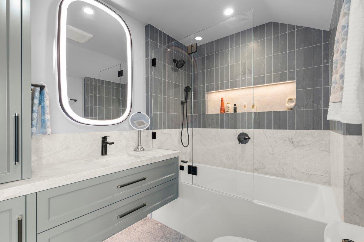 14966 Sobey Road Saratoga, CA 95070 - Photo 32 of 70 a bathroom with a sink a toilet and shower