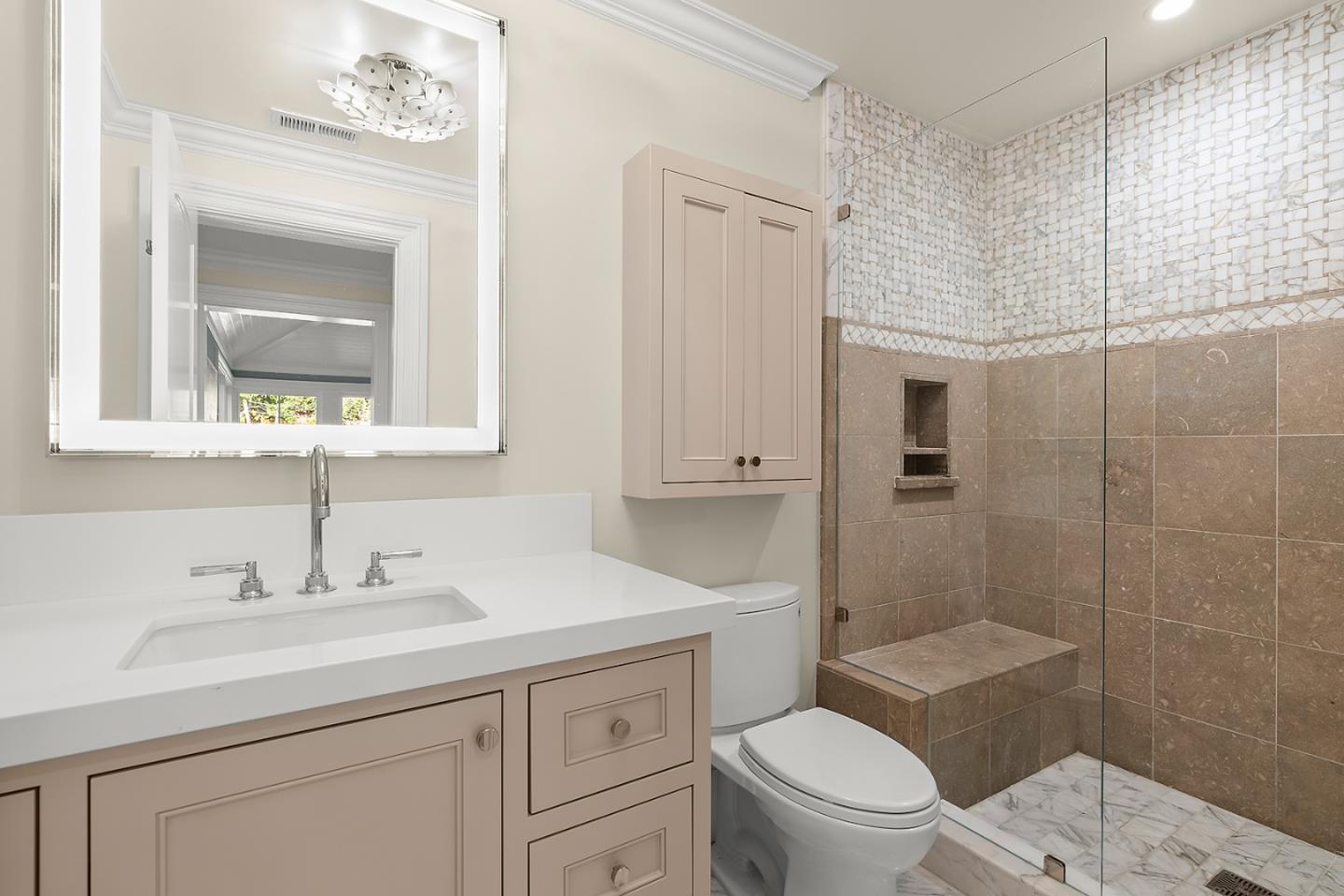 14966 Sobey Road Saratoga, CA 95070 - Photo 40 of 70 a bathroom with a toilet a sink a mirror a vanity and shower