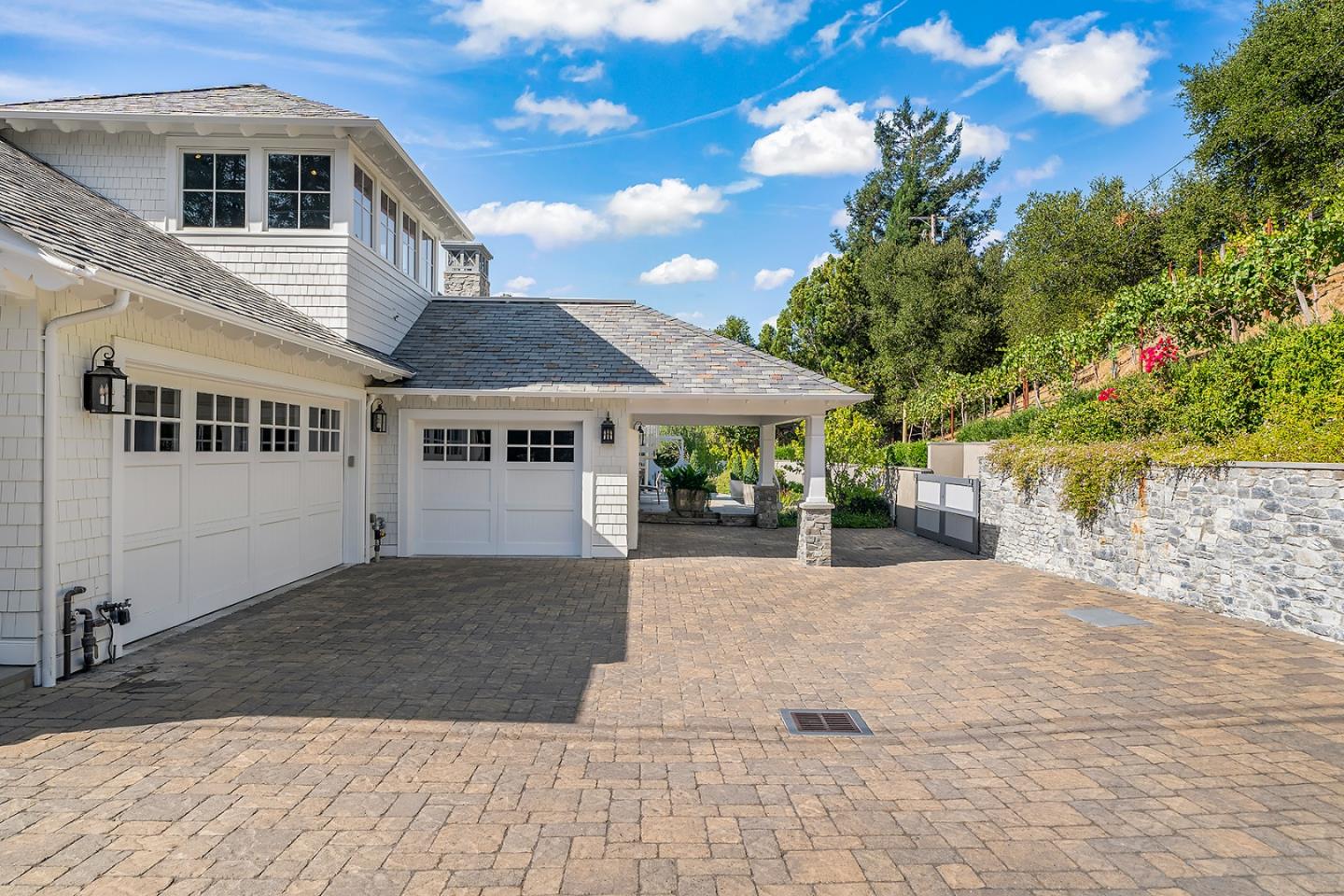 14966 Sobey Road Saratoga, CA 95070 - Photo 4 of 70 a front view of a house with a yard and potted plants